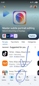 A screenshot of a smartphone screen open to the Google Play Store. The search button at the bottom is circled, and there is an arrow pointing to it.